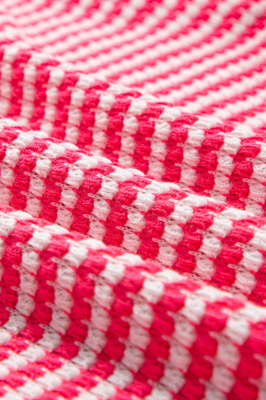 Pink and white textured stripe blouse with balloon sleeves.
