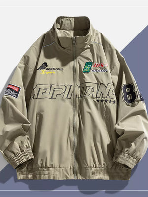 Khaki bomber jacket with embroidered patches and text details, full zip, stand collar, ribbed cuffs and hem.