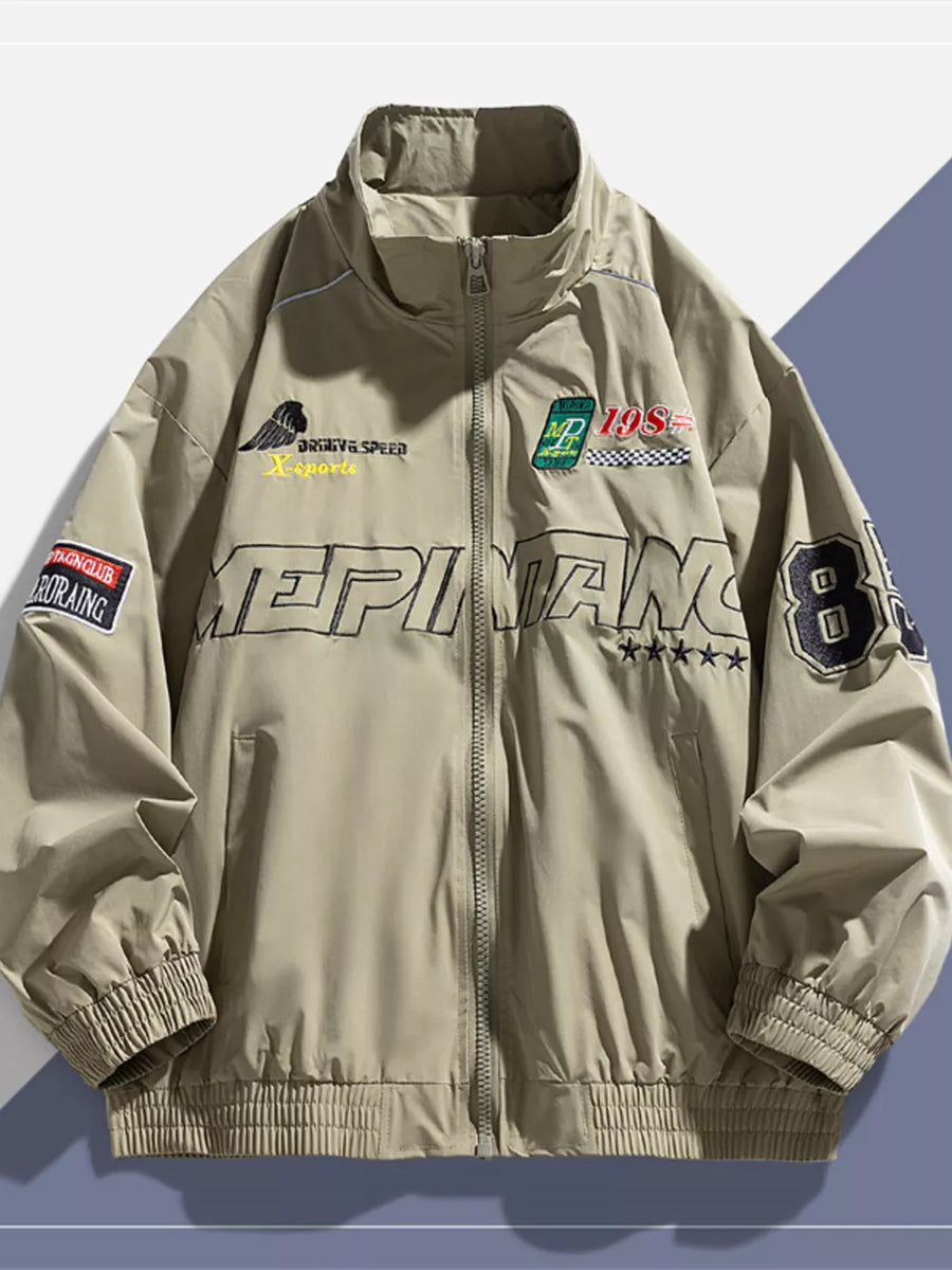 Khaki bomber jacket with embroidered patches and text details, full zip, stand collar, ribbed cuffs and hem.