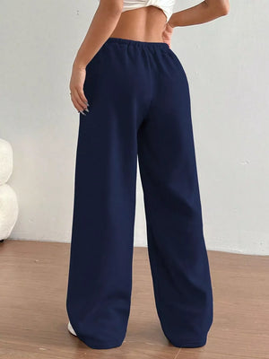 Dark blue wide-leg maternity joggers with elastic waistband and relaxed fit.