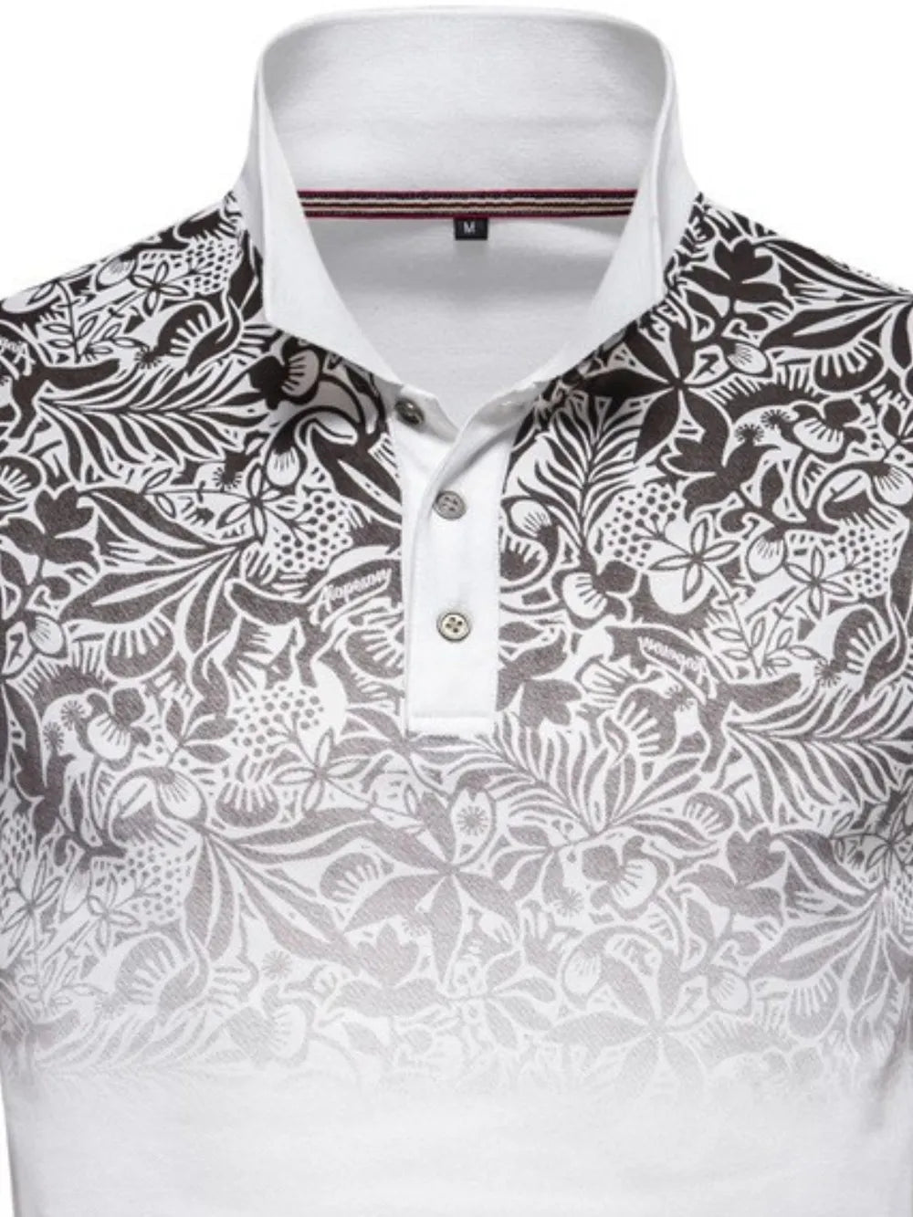 Floral ombre polo shirt with a white collar and button placket.