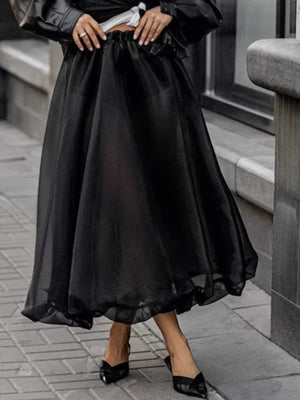 Black midi skirt with sheer overlay and ruffled hem, elastic waist