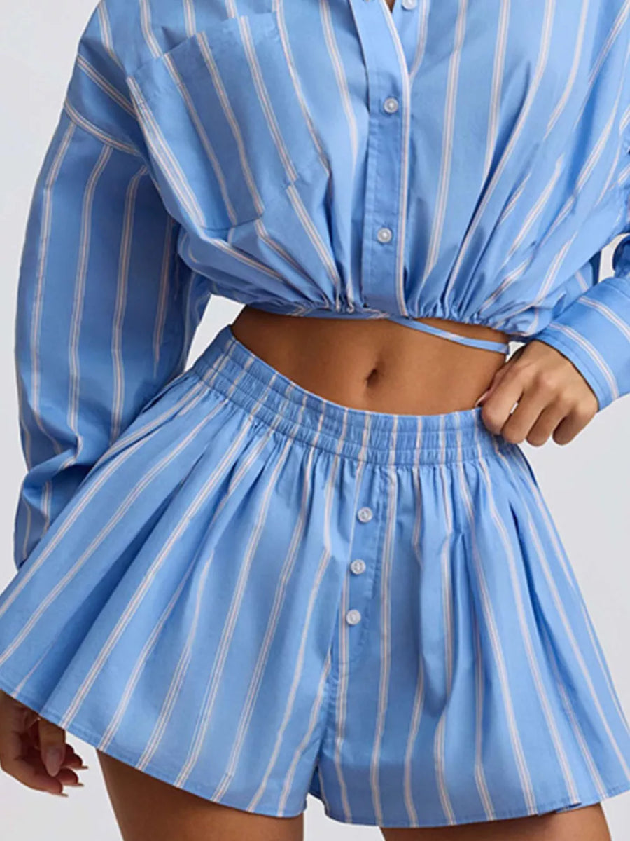 Blue striped button-front shorts with elastic waistband and pleated detail.