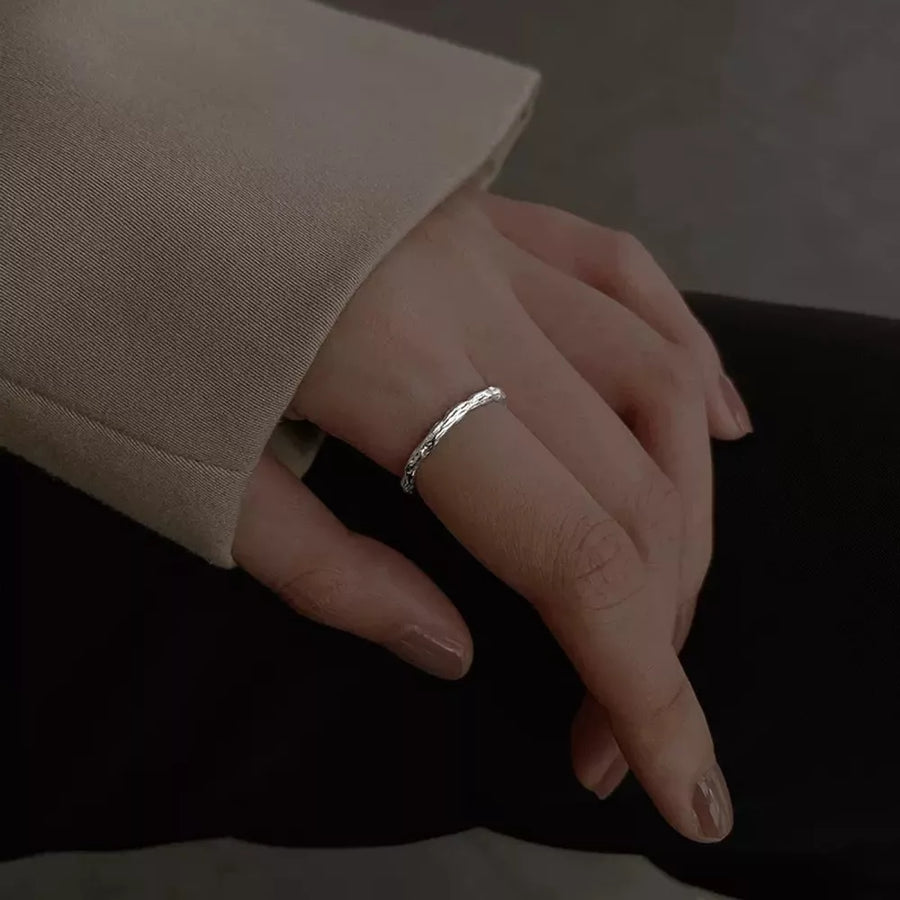 ring in silver with textured and textured