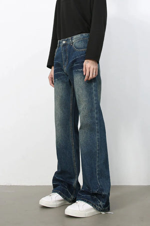 Faded wash flare jeans in dark denim with a relaxed fit and bootcut leg.
