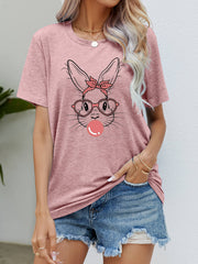 Dusty pink t-shirt with a graphic of a bunny wearing glasses and a bandana, blowing bubblegum.
