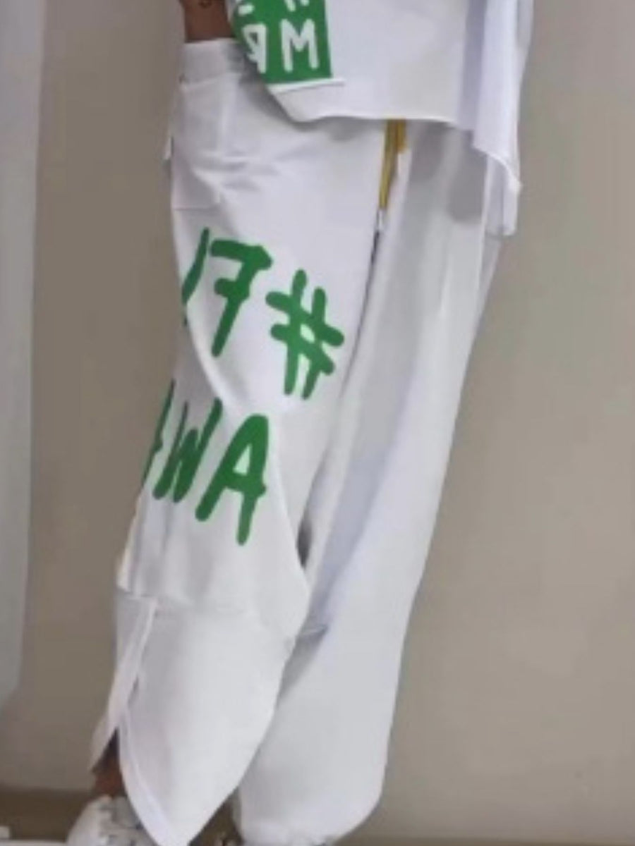 White graphic tee and drawstring pants set with green lettering