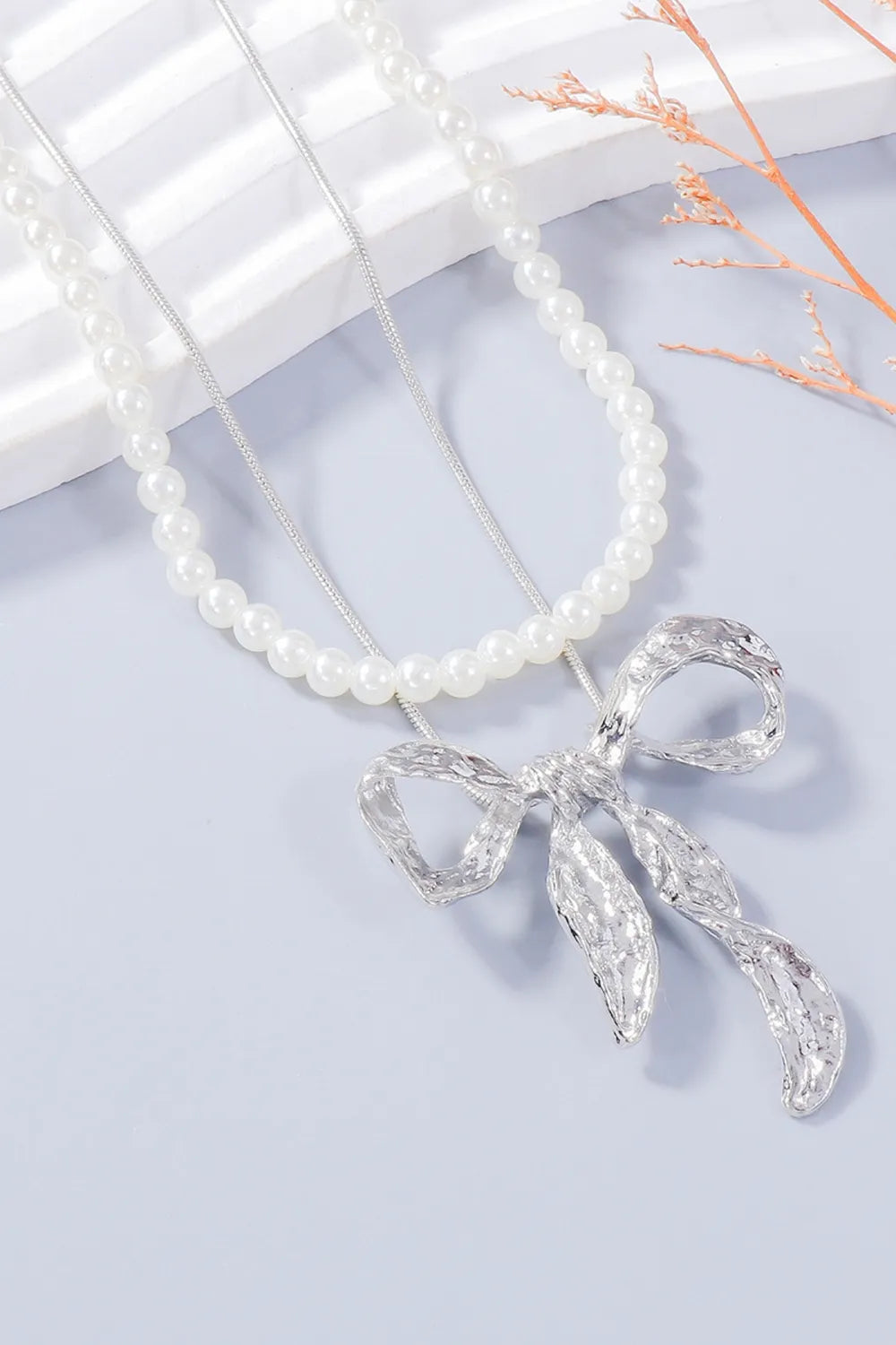 Silver textured bow jewelry set with pearl necklace