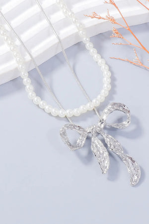Silver textured bow jewelry set with pearl necklace
