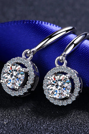 Silver moissanite halo drop earrings with sparkling round-cut center stones.