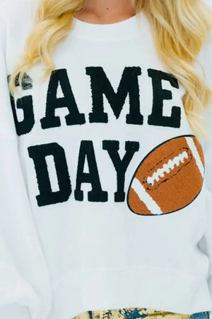 White sweatshirt with black "GAME DAY" graphic and football detail