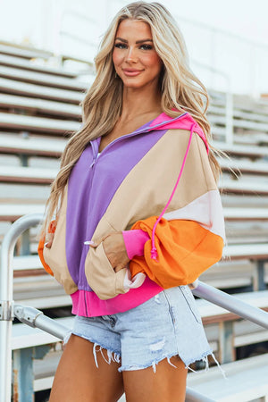 Colorblock zip-up hoodie with balloon sleeves in purple, tan, orange, and pink.