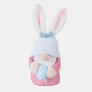 Pink bunny ear knit gnome decoration holding a blue egg, with a blue bow.