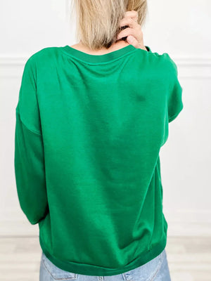 Green plaid letter graphic sweatshirt with crew neck and long sleeves.