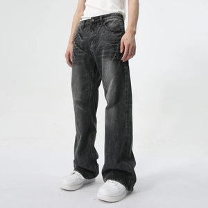 Washed black wide-leg denim jeans with a relaxed fit and subtle distressing.