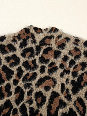 Leopard print fuzzy knit cardigan with a mock neck detail.