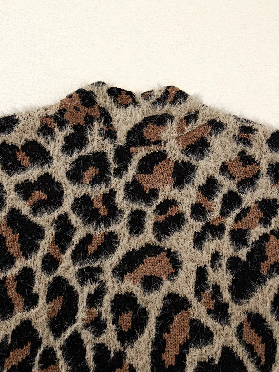 Leopard print fuzzy knit cardigan with a mock neck detail.