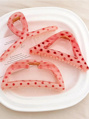 Polka dot claw hair clips in pink with red dots, available in Style A, B, and C.