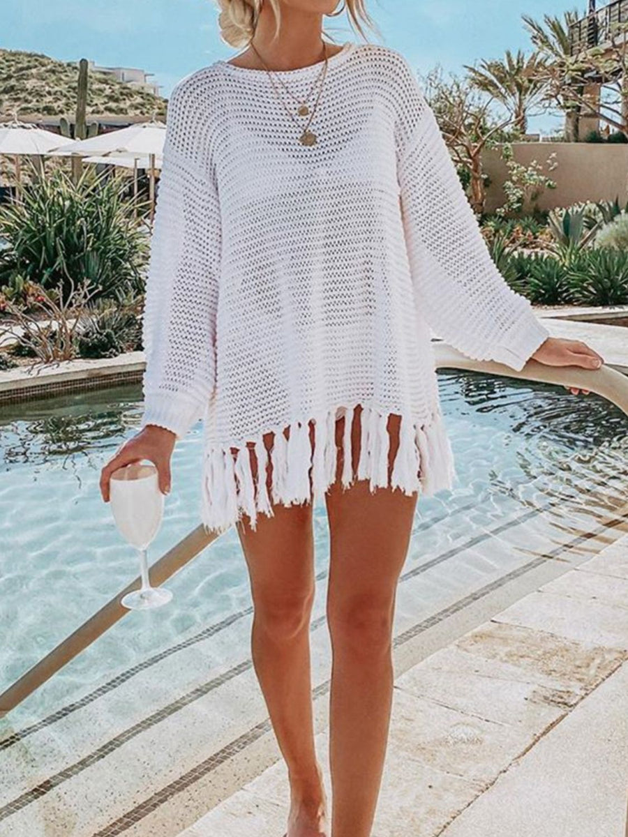 White open-knit acrylic beach cover-up with fringe hem, long sleeves and crew neck.