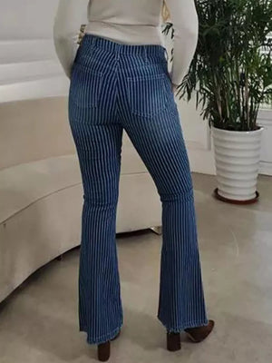 Blue denim maternity flare jeans with vertical white stripes and button fly