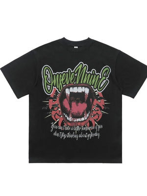 Black 100% cotton oversized t-shirt with graphic of open mouth with fangs and text.