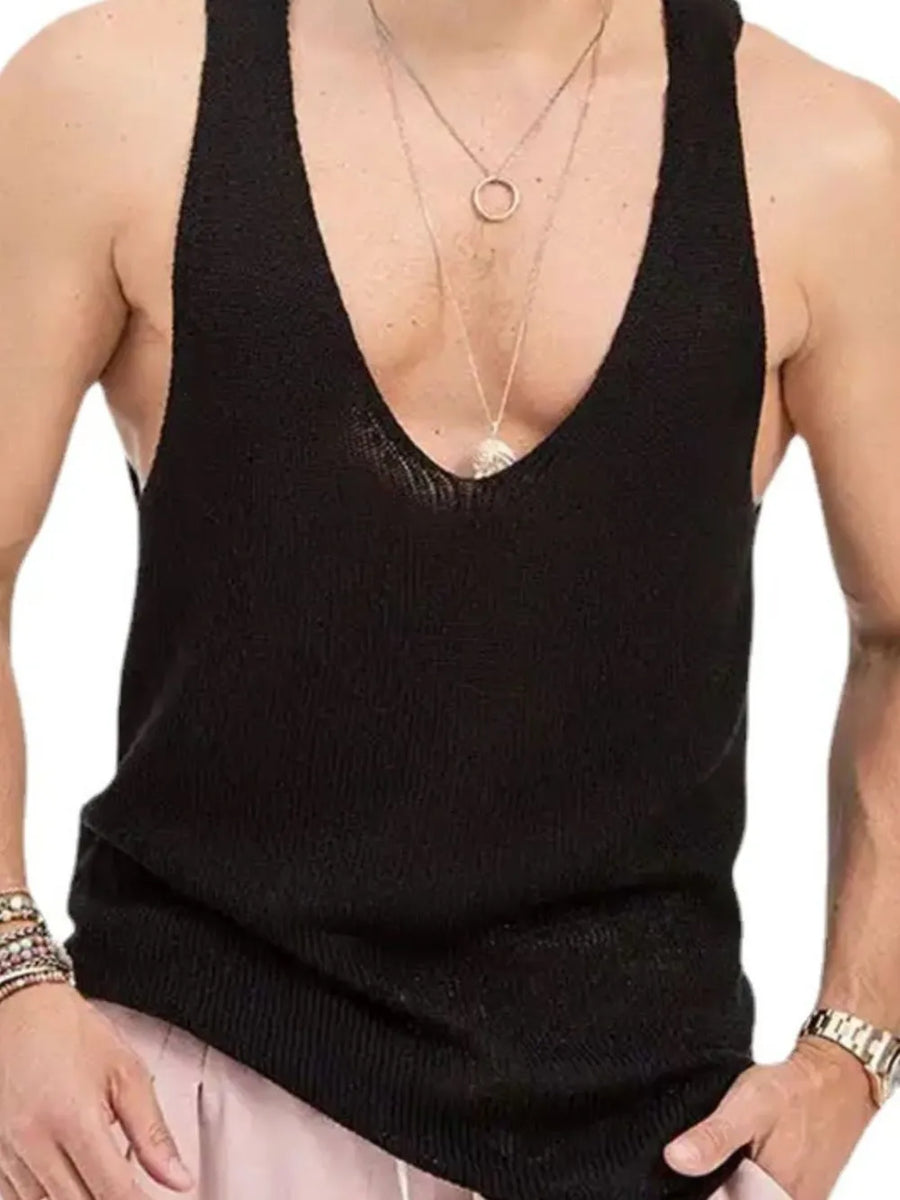 Black knit tank top for him with deep V-neck, worn with layered necklaces.
