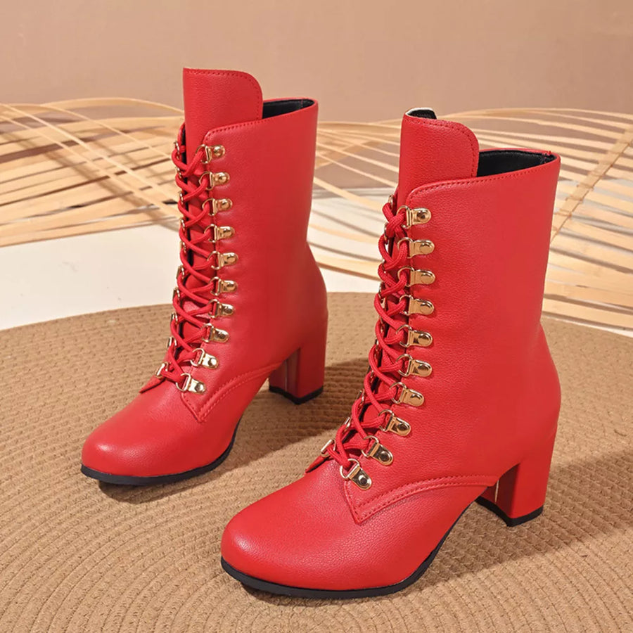 Red lace-up block heel boots with gold hardware.