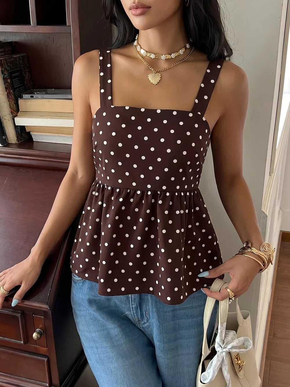 Brown polka dot camisole with square neckline and tie-back detail.