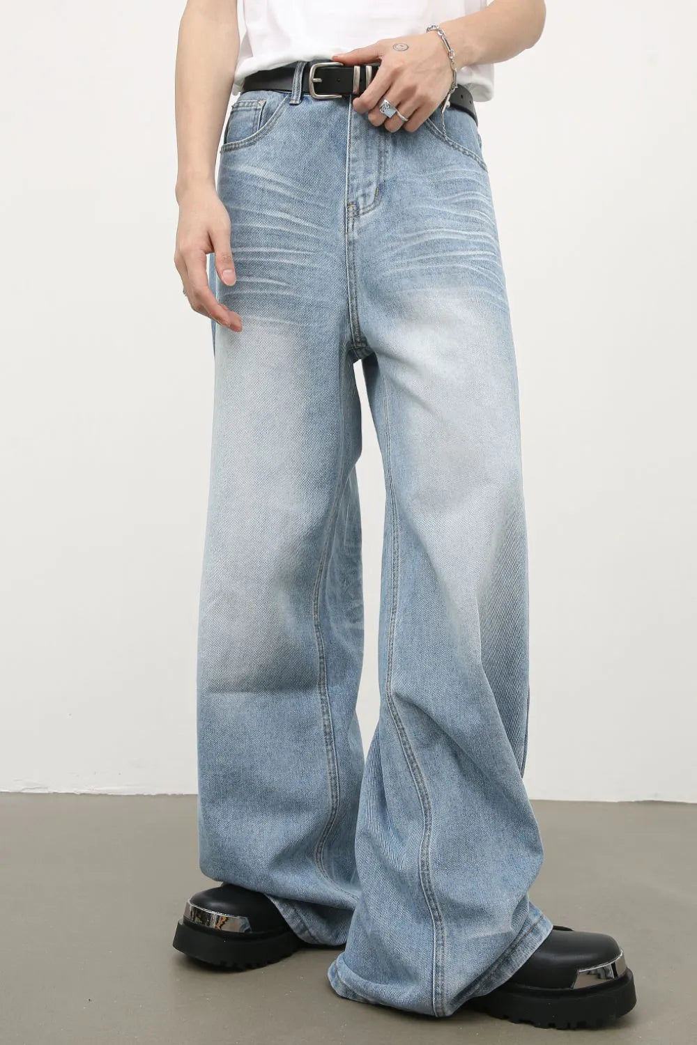 Light blue baggy denim palazzo jeans with a faded wash and wide leg.