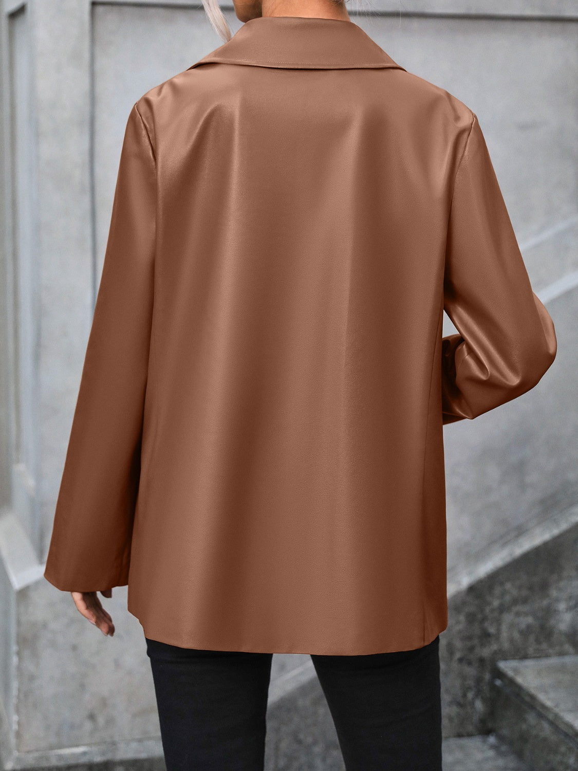 Brown faux leather tailored blazer with a classic collar and long sleeves.