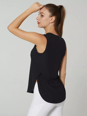 Black sleeveless high neck top with side slits and curved hem