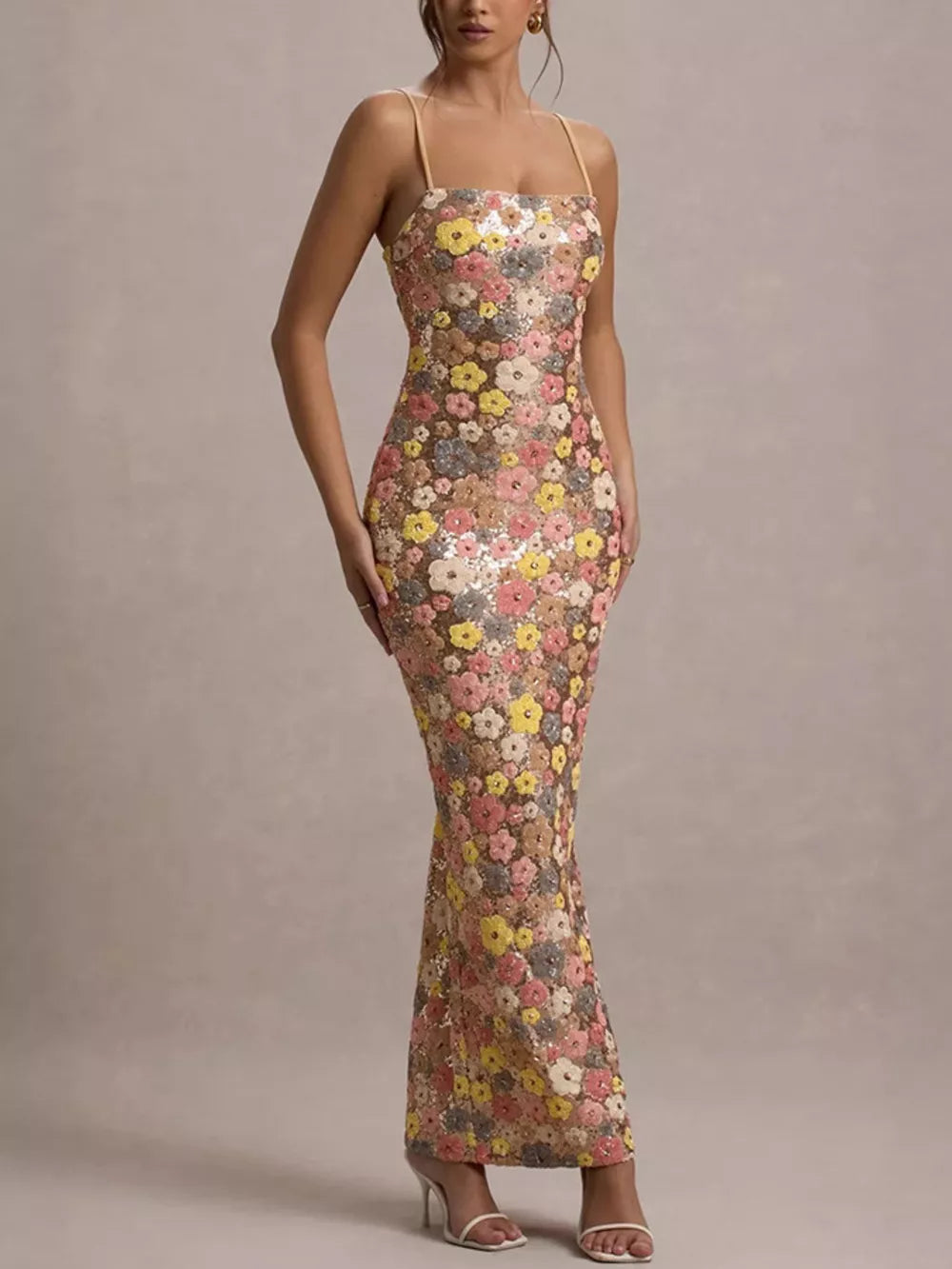 Floral sequin maxi dress with spaghetti straps and a bodycon fit.