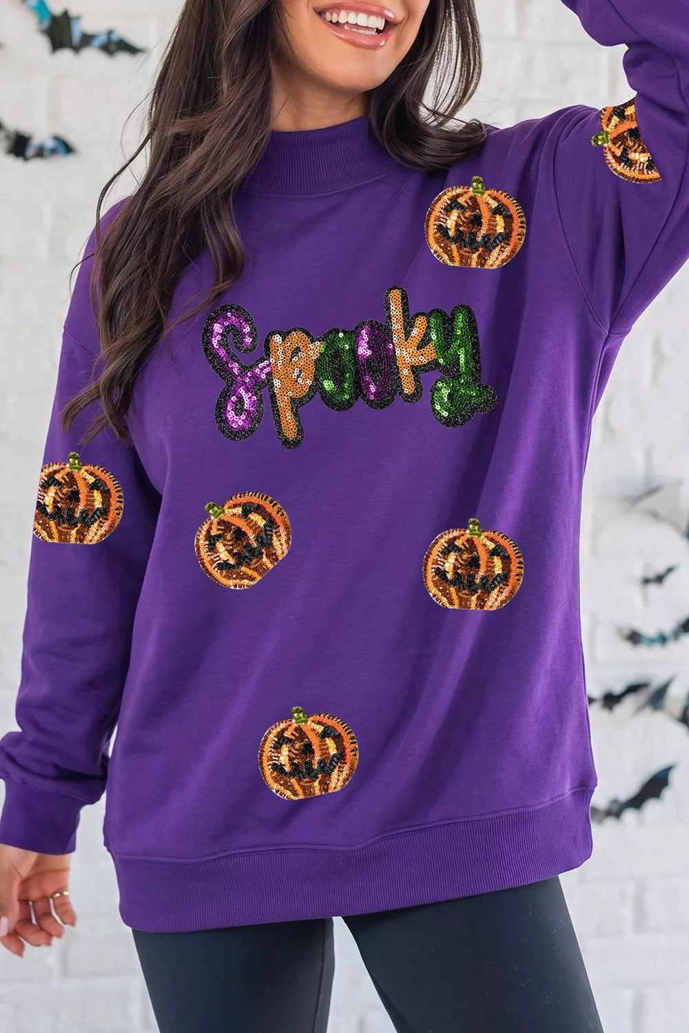 50% polyester, 50% cotton Care instructions: Machine wash cold sweatshirt in purple with relaxed silhouette