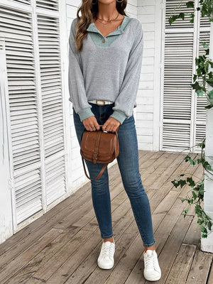 Gray ribbed maternity shirt with contrast collar and button detail.