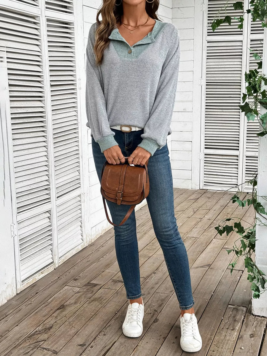 Gray ribbed maternity shirt with contrast collar and button detail.