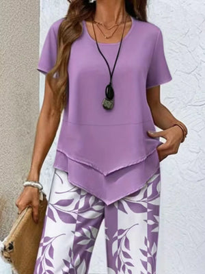 Lavender layered tunic with short sleeves and white leaf-print pants