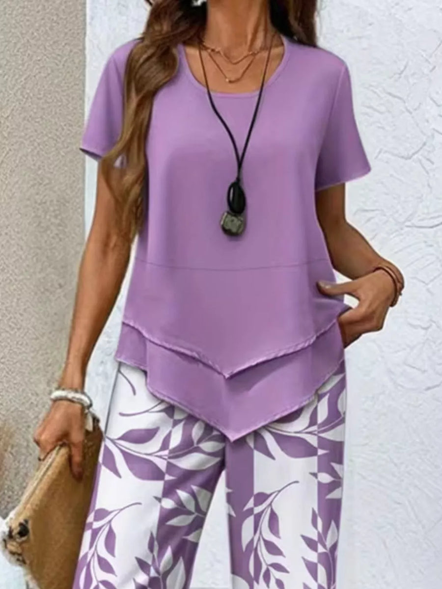 Lavender layered tunic with short sleeves and white leaf-print pants