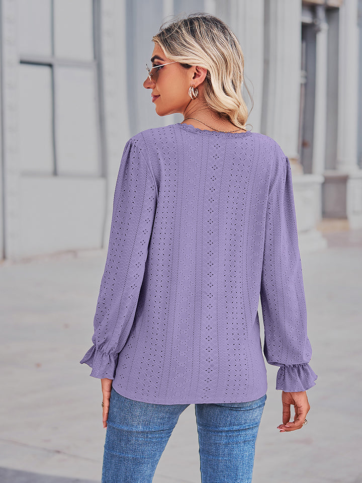 Lavender lace-cut prairie blouse with ruffled sleeves and eyelet details.
