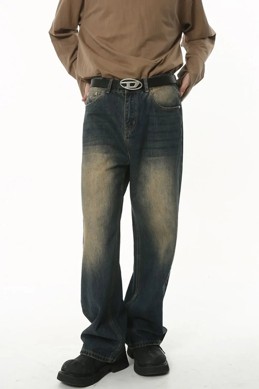 Faded wash baggy denim jeans in dark wash with a distressed look.