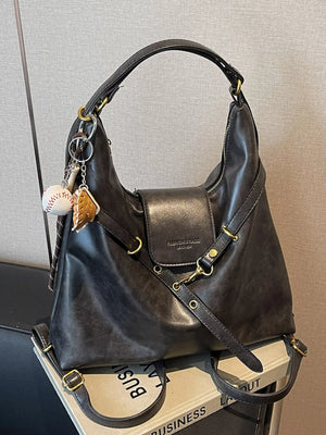 Convertible dark brown PU leather hobo bag with baseball and cookie charms