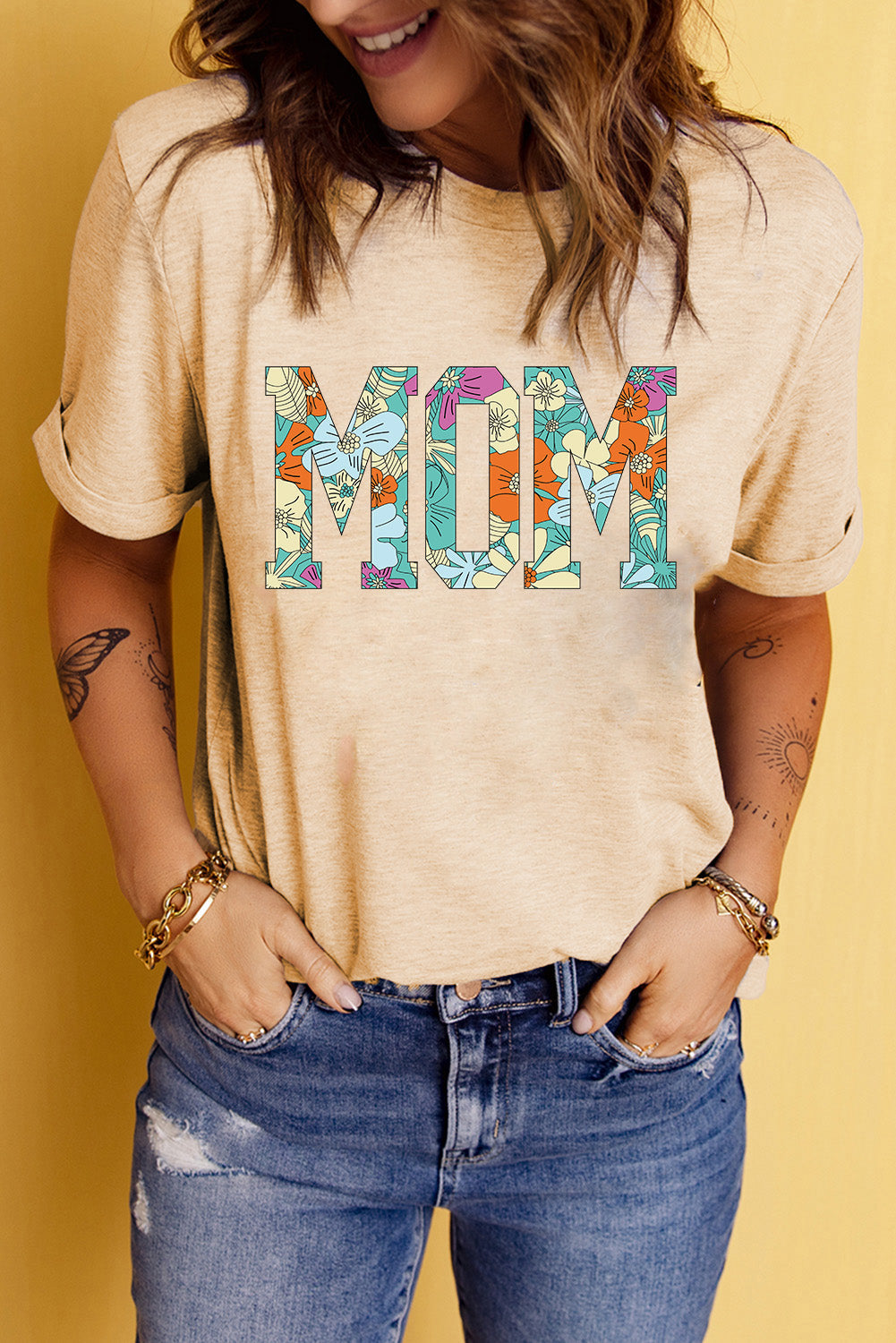 Light apricot floral mom graphic tee with rolled sleeves and casual fit.