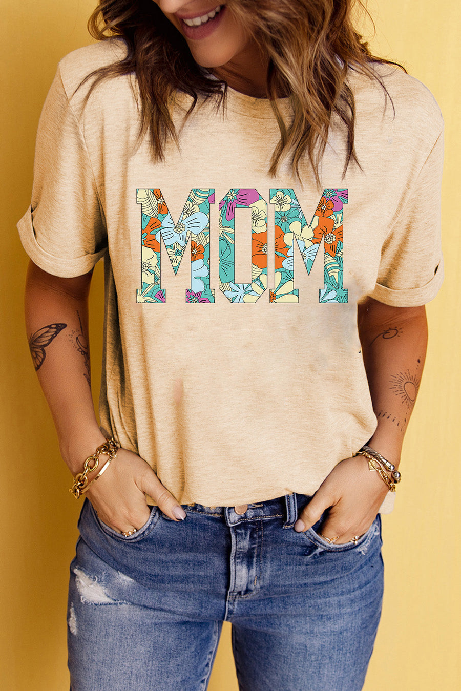 Light apricot floral mom graphic tee with rolled sleeves and casual fit.