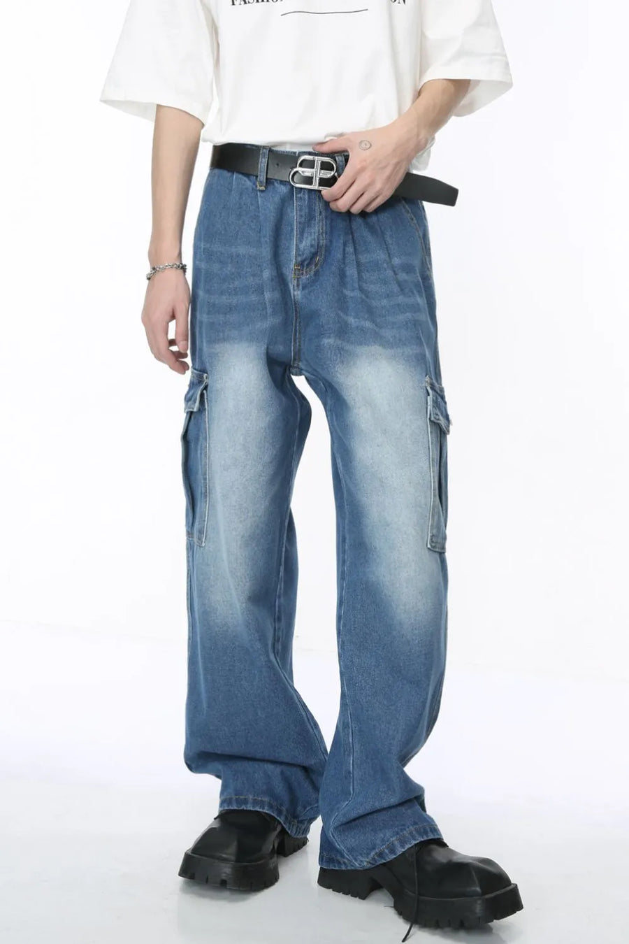Pleated wide-leg denim cargo pants in medium wash with cargo pockets and a relaxed fit.