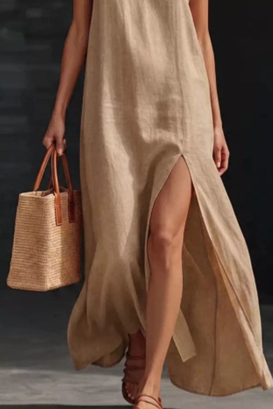 Khaki V-neck maxi dress with high slit, sleeveless, and side pocket detail.