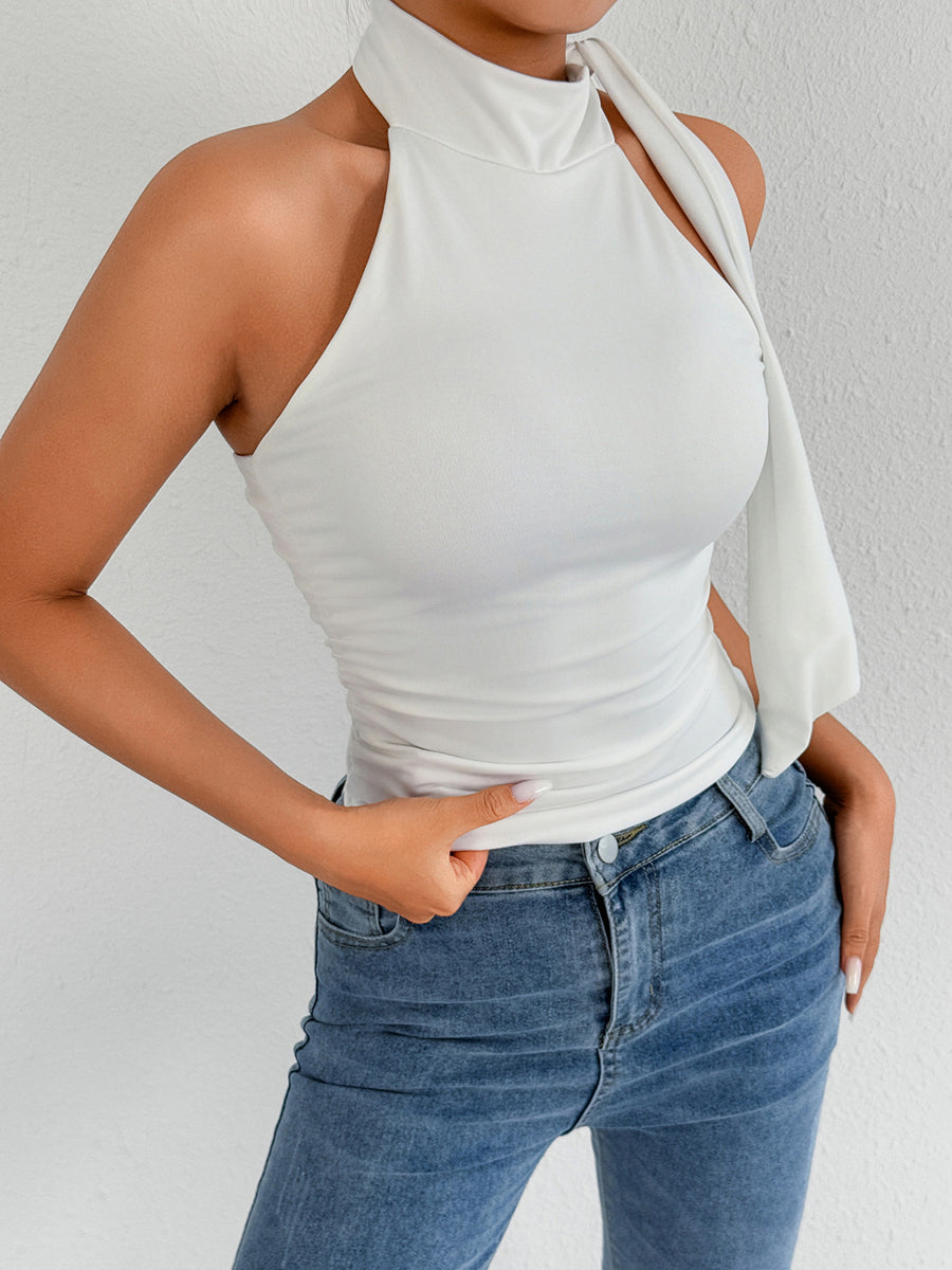 White halter neck tank top with draped tie detail and ruched sides.