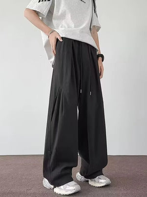 Black relaxed fit casual cargo pants with drawstring waist and wide leg.