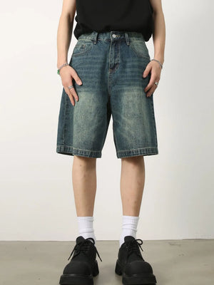 Baggy denim bermuda shorts in light blue with a washed effect and buttoned fly.
