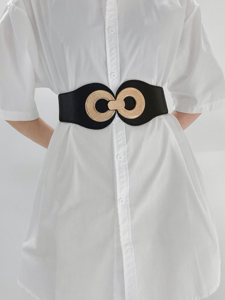 Black elastic belt with gold metalwork double circle clasp cinches waist