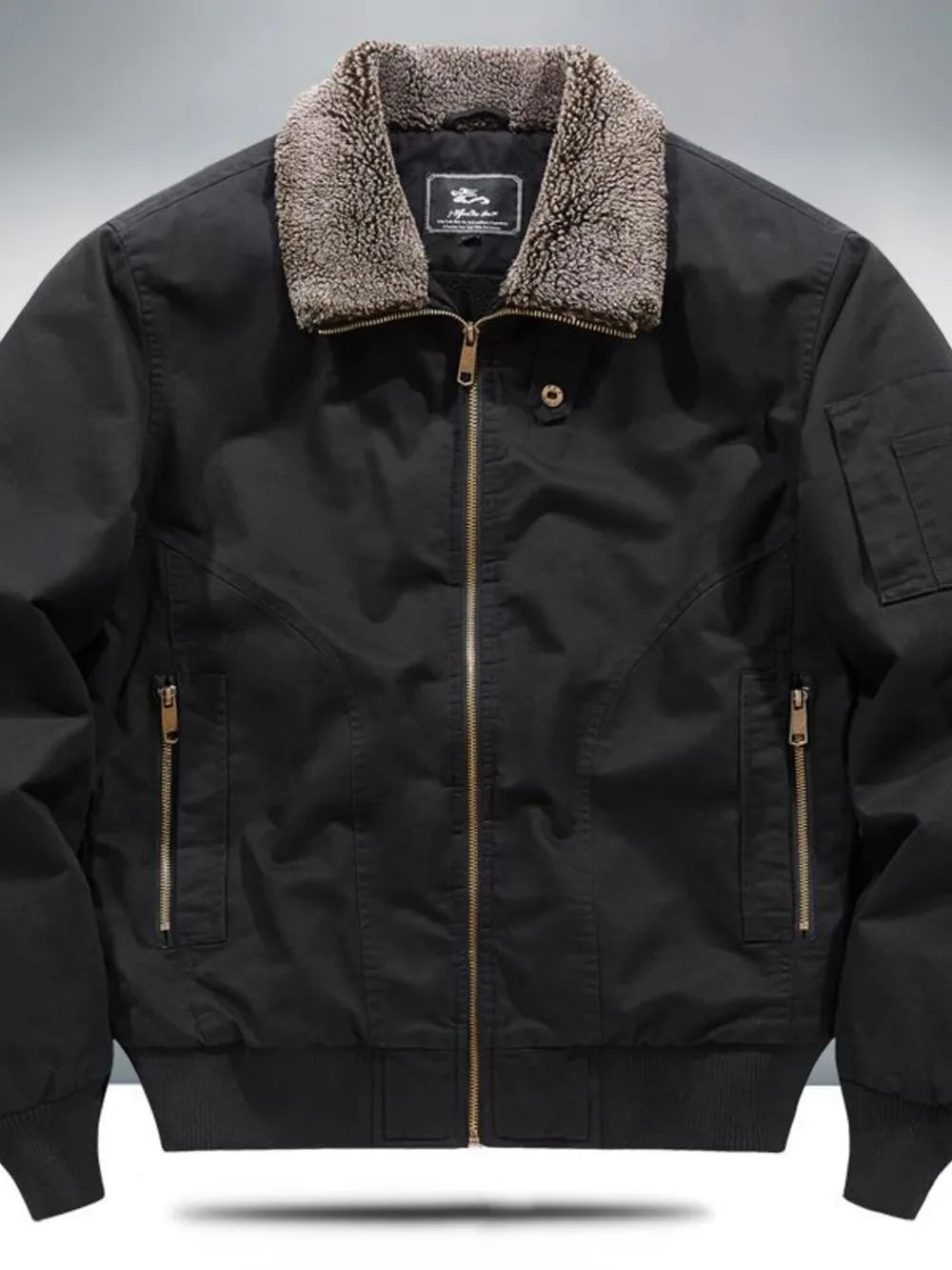 Black bomber jacket with sherpa collar, zip front, and zippered pockets.
