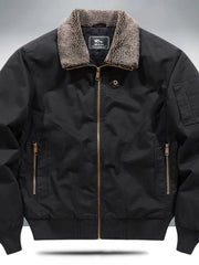 Black bomber jacket with sherpa collar, zip front, and zippered pockets.